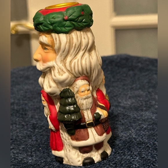 Set of 2 Santa candleholders. Each has smaller different smaller Santas. - Picture 2 of 11